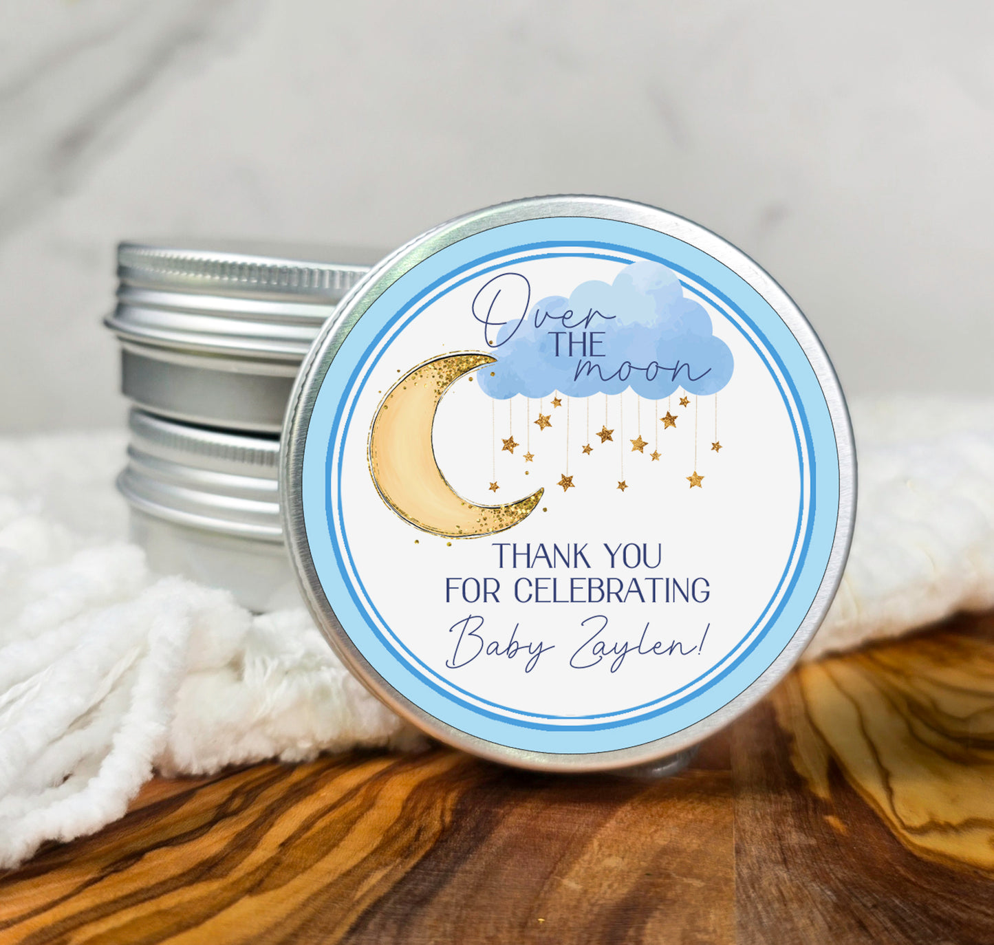a tin of thank you for celebrating with a moon and stars on it