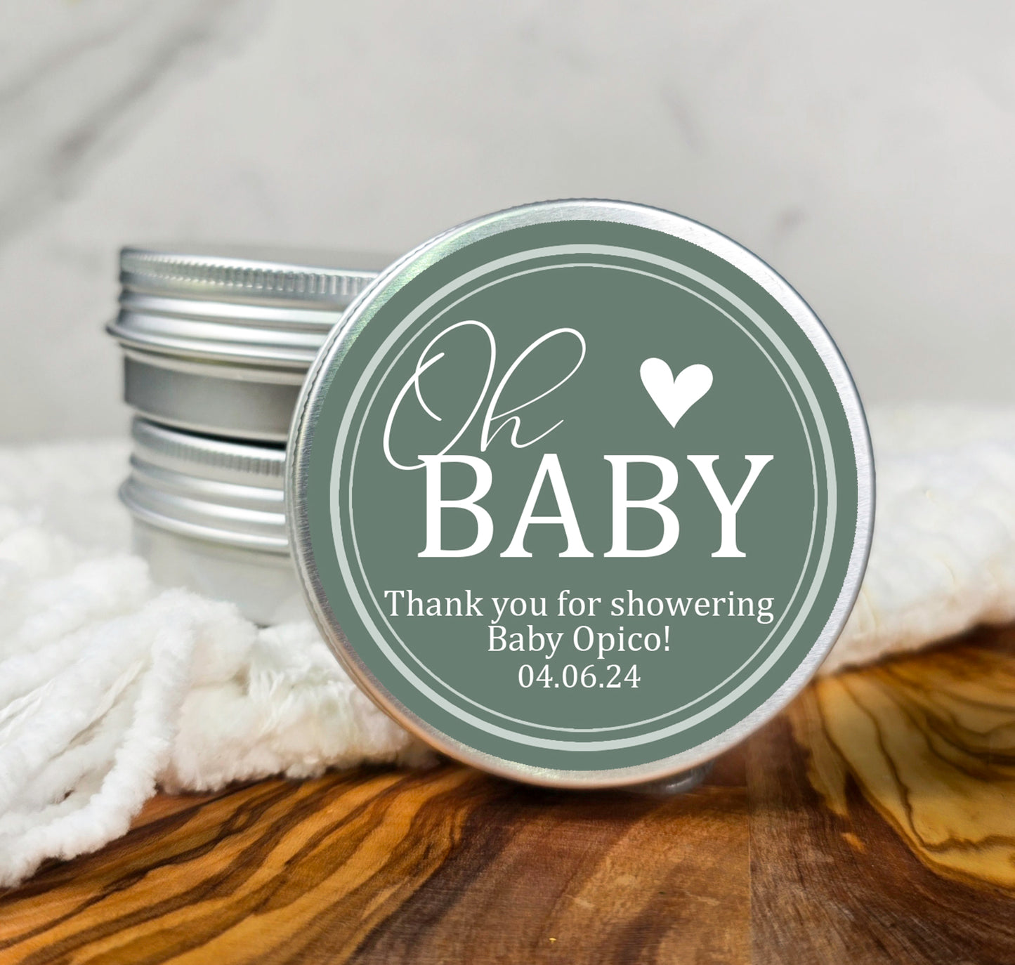 a small tin with a baby on it sitting on a table