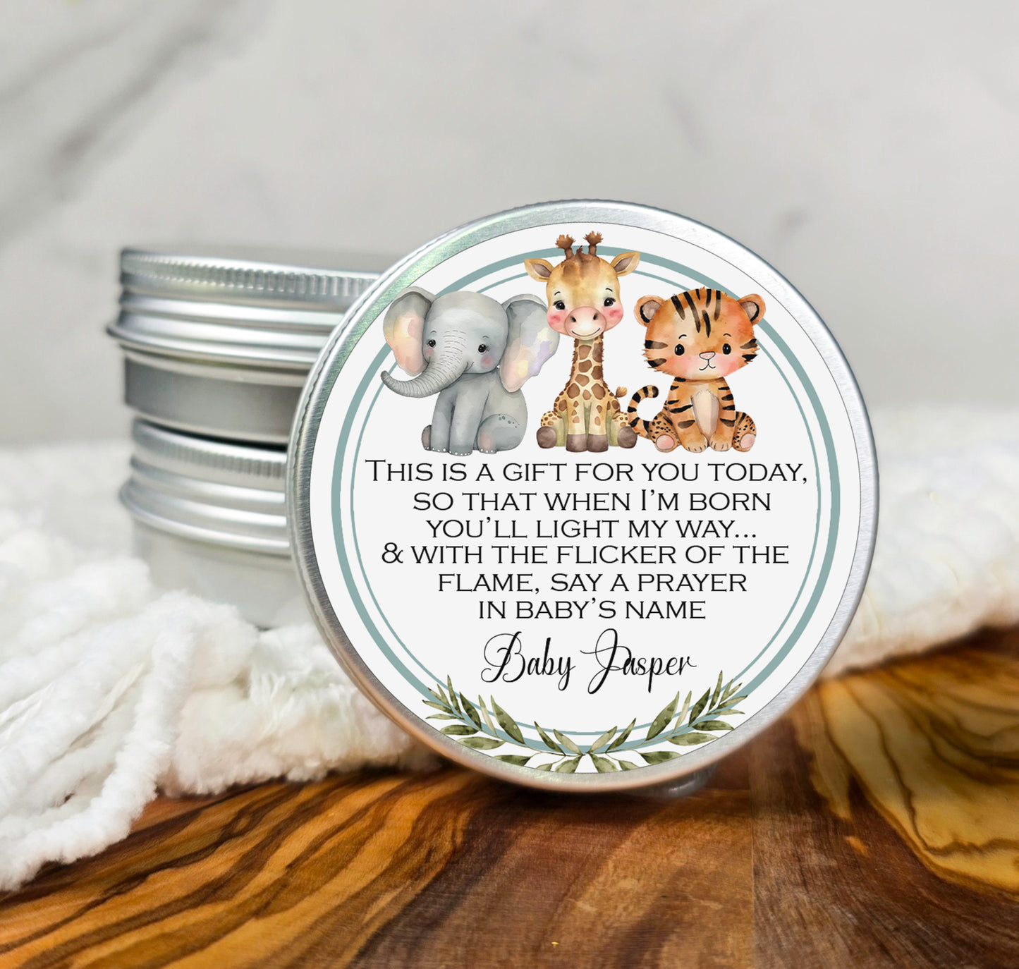 a small tin with a picture of a giraffe and a baby elephant on