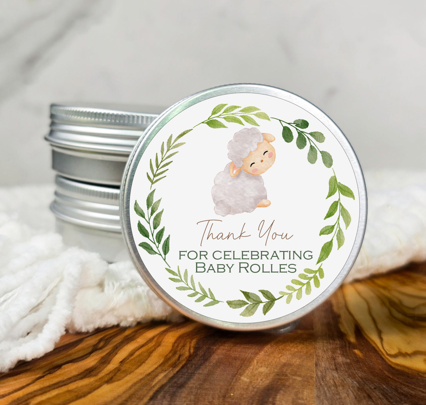 a tin of baby rolls with a sheep on it