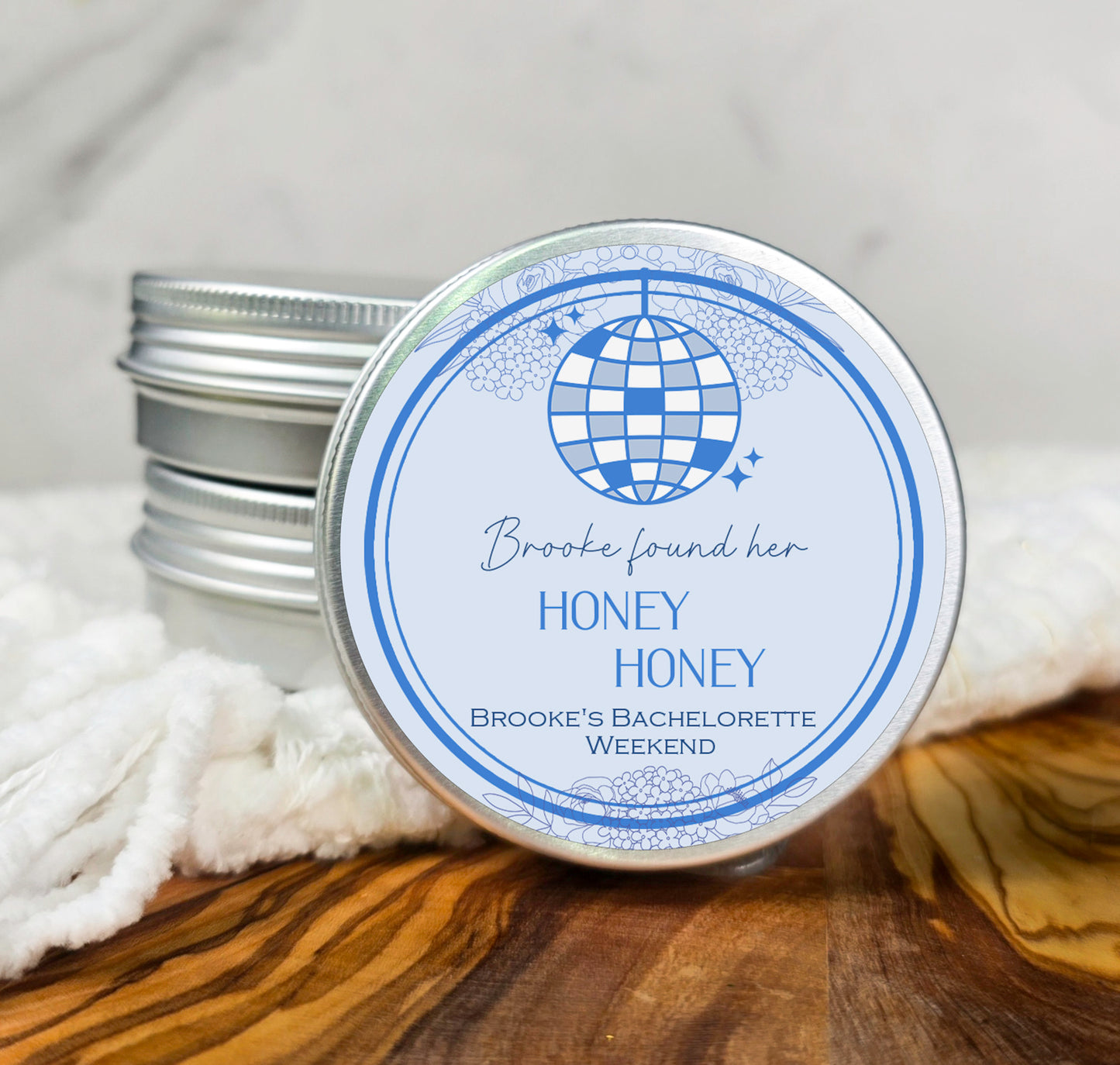 a jar of honey honey on a wooden table