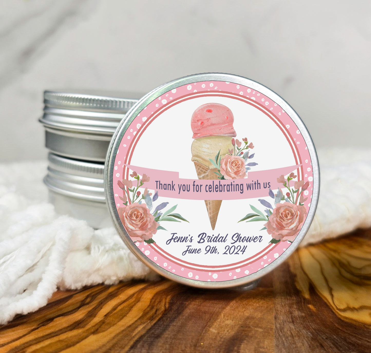 a small tin of personalized ice cream sits on a table