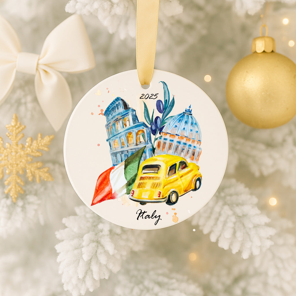 A circular ornament hanging on a Christmas tree, featuring a painting of the Colosseum, a yellow car, and an Italian flag.