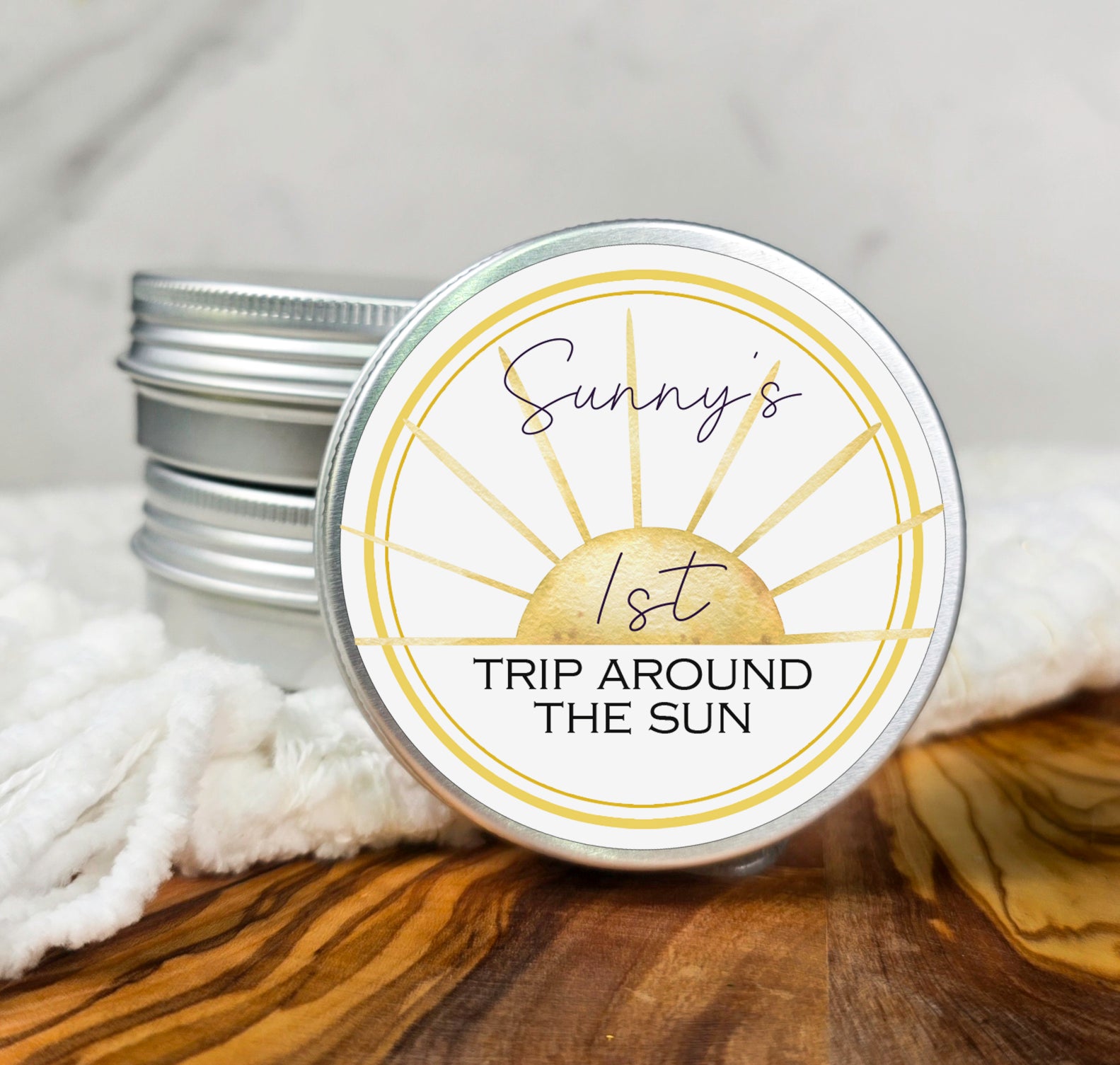 a small tin of sunburst's trip around the sun on a wooden