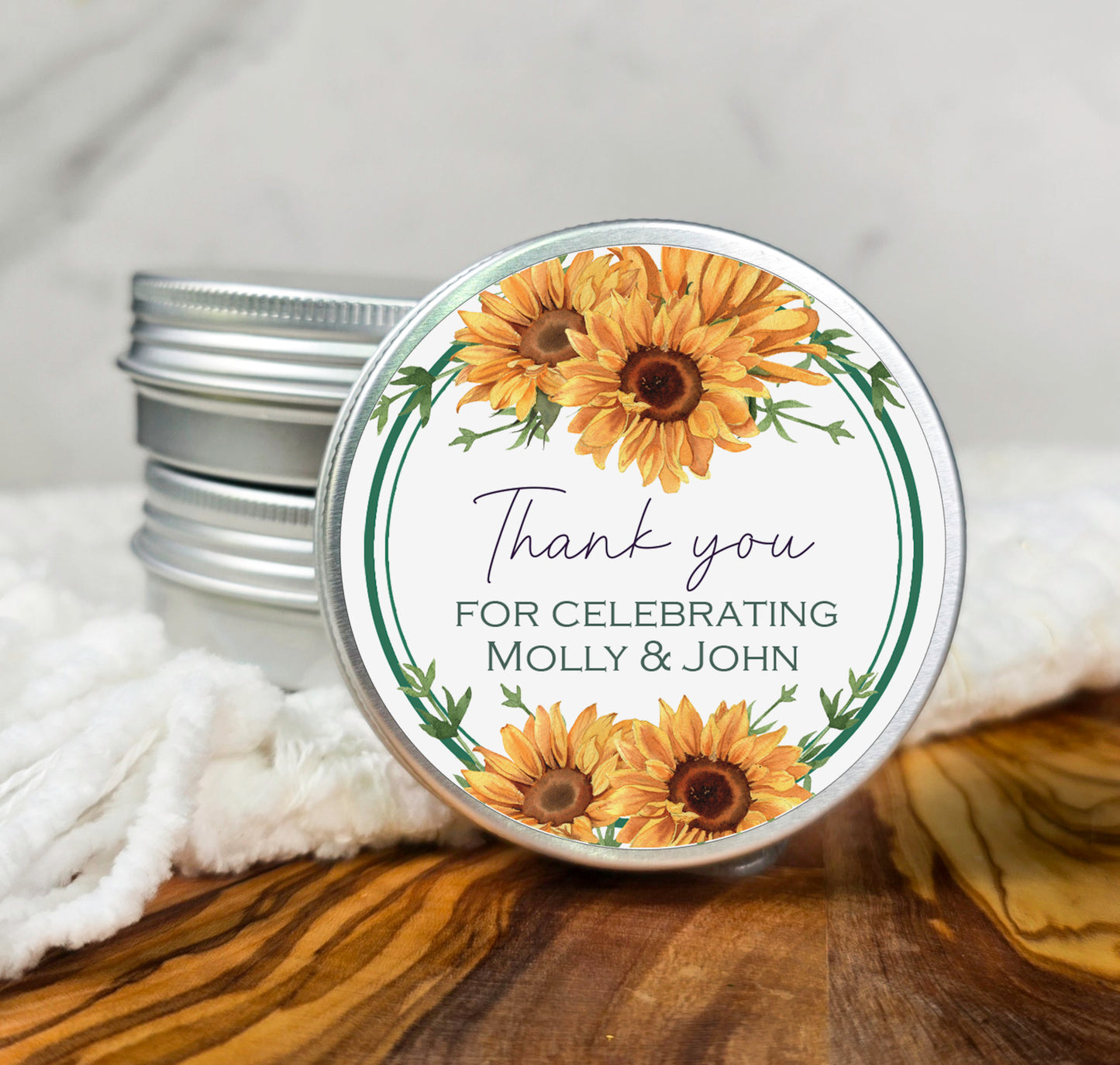 a tin of sunflowers with a thank you label on it