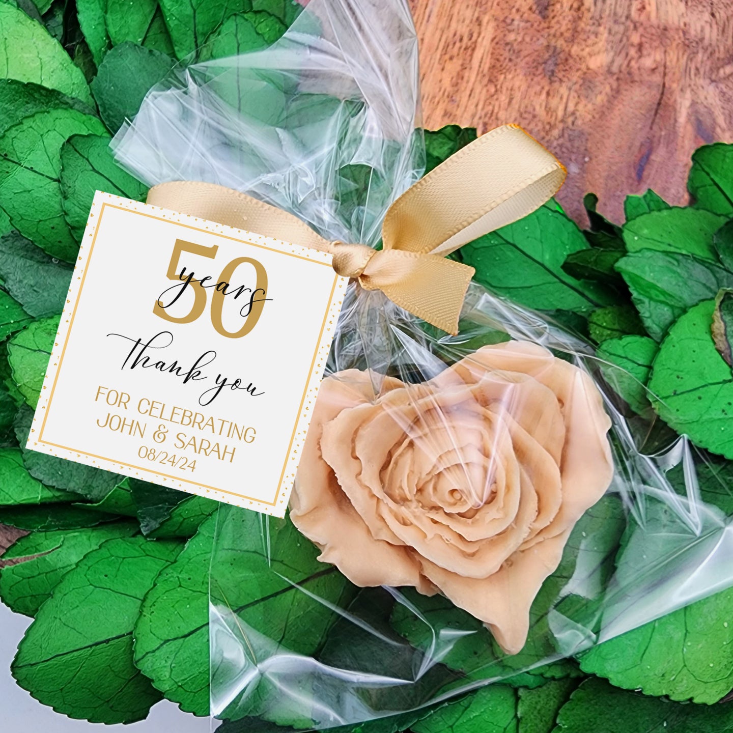 a gift wrapped in plastic and tied with a ribbon