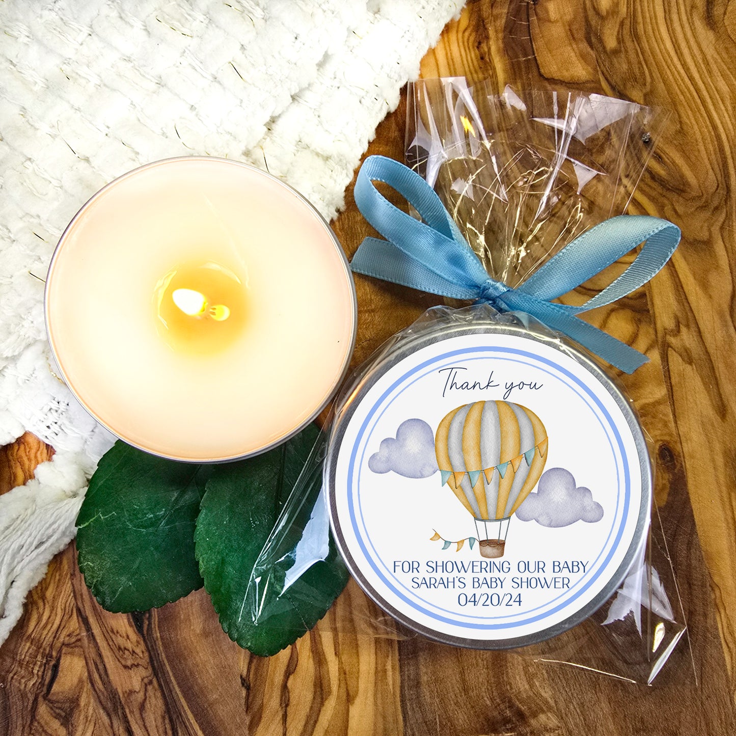 a candle and a jar of soap on a table