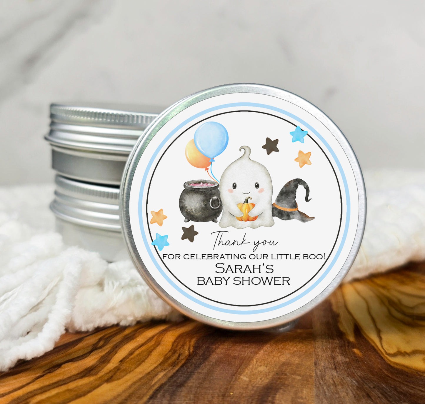 a small tin of baby shower products sitting on a table