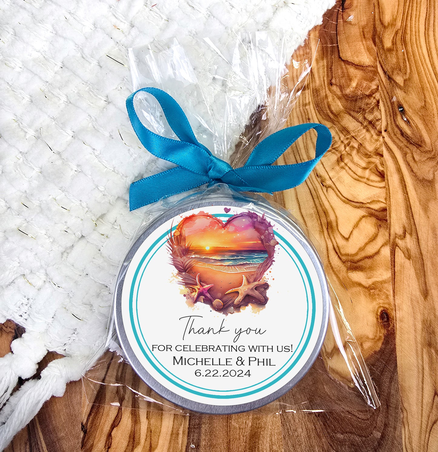 a small jar of soap with a blue ribbon around it