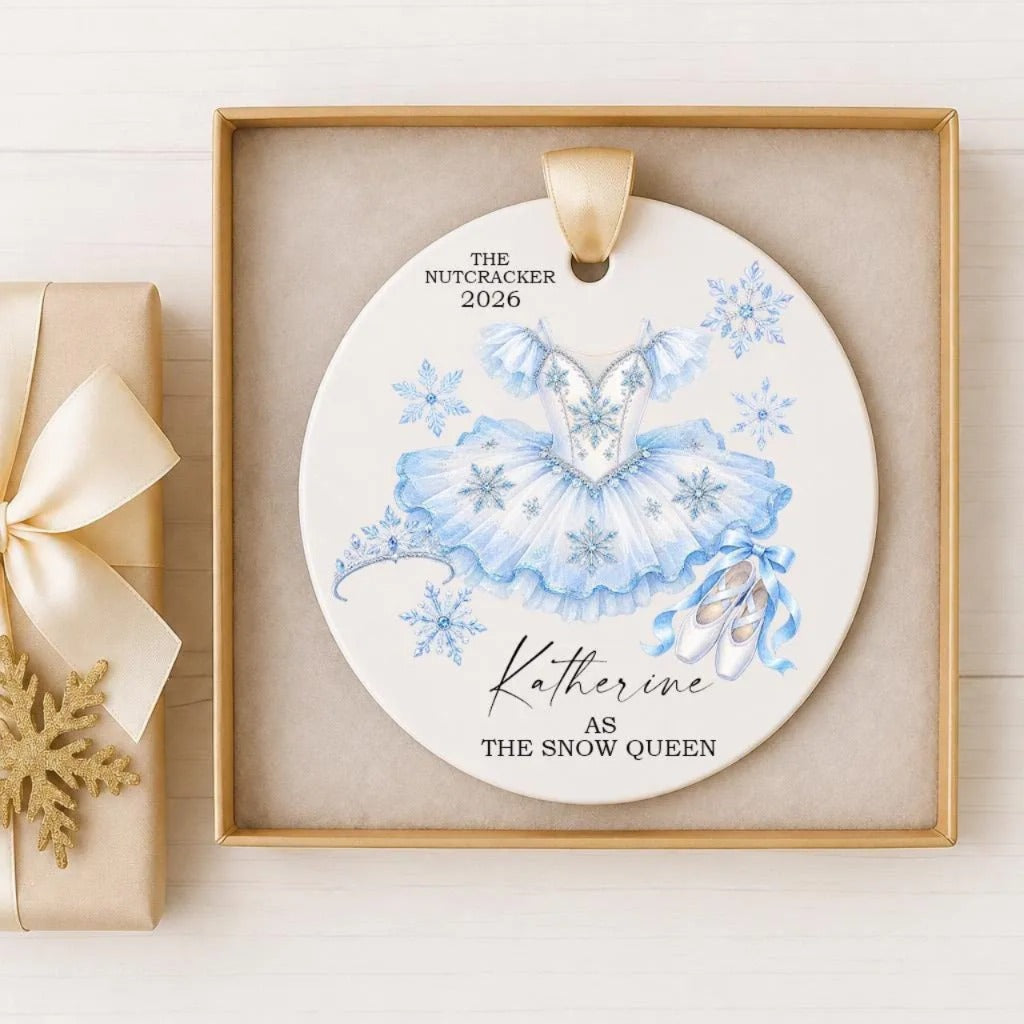 A decorative ornament featuring a blue tutu and snowflakes, with the text "The Nutcracker 2020" and "Katharine as the Snow Queen" printed on it.