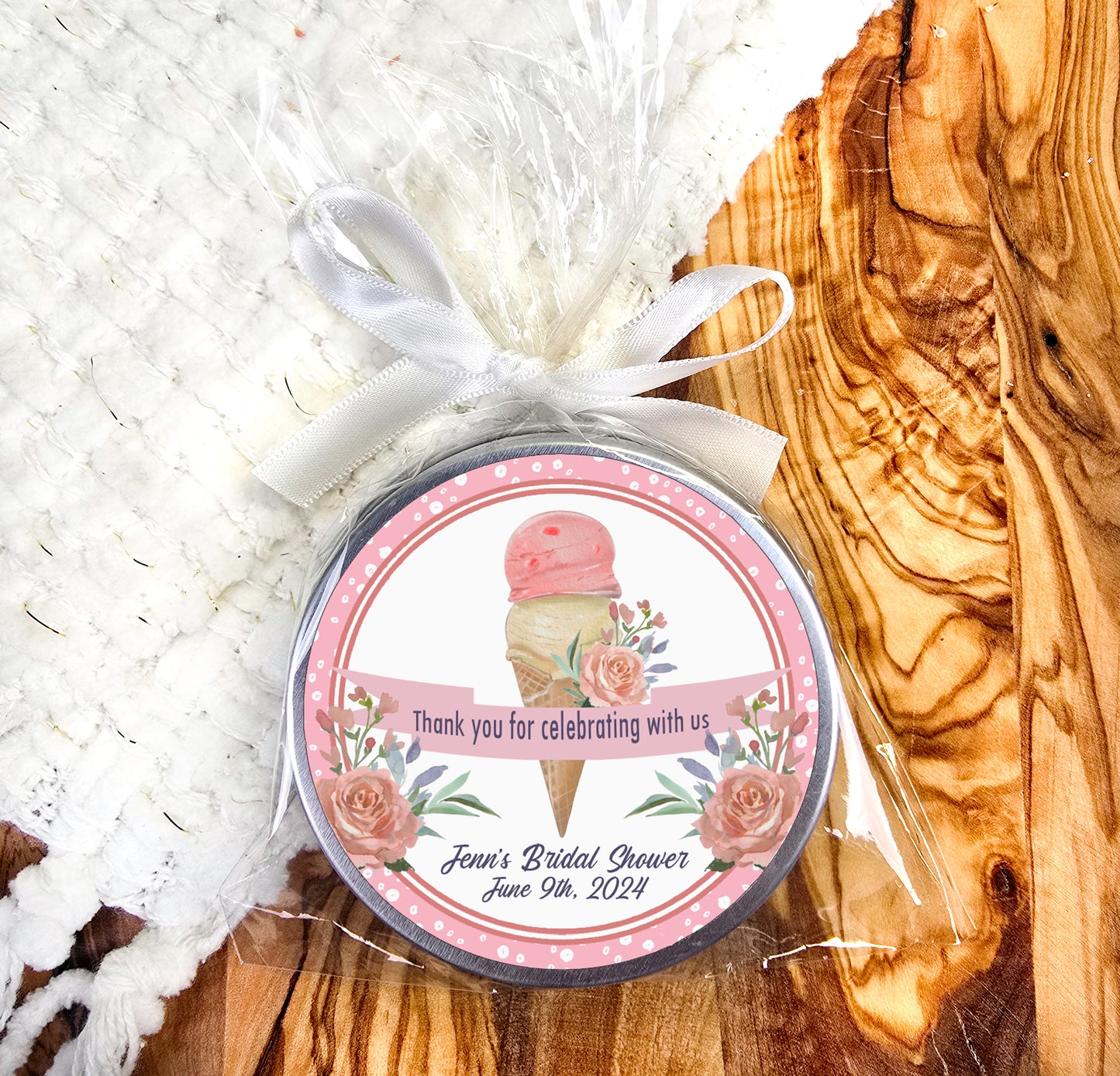 a small jar of ice cream sitting on top of a wooden table