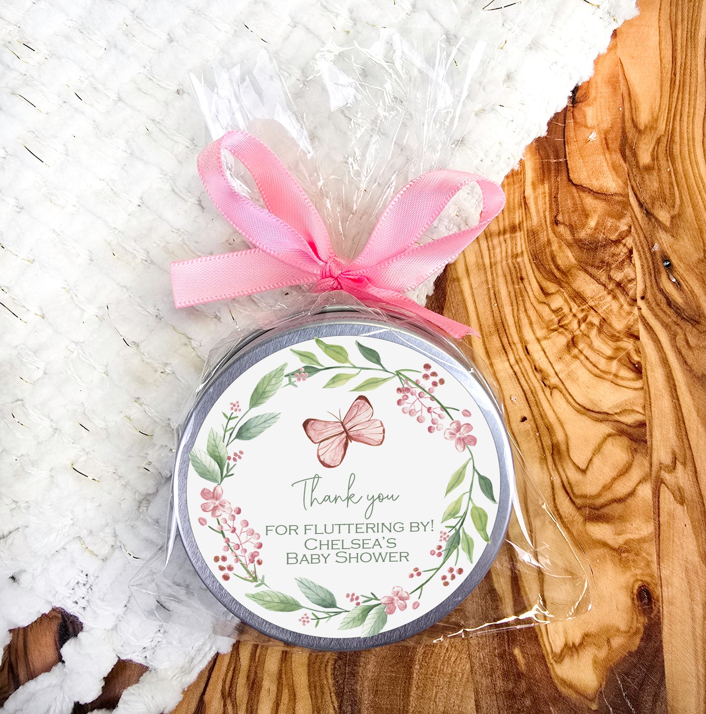 a jar of soap with a pink bow on it