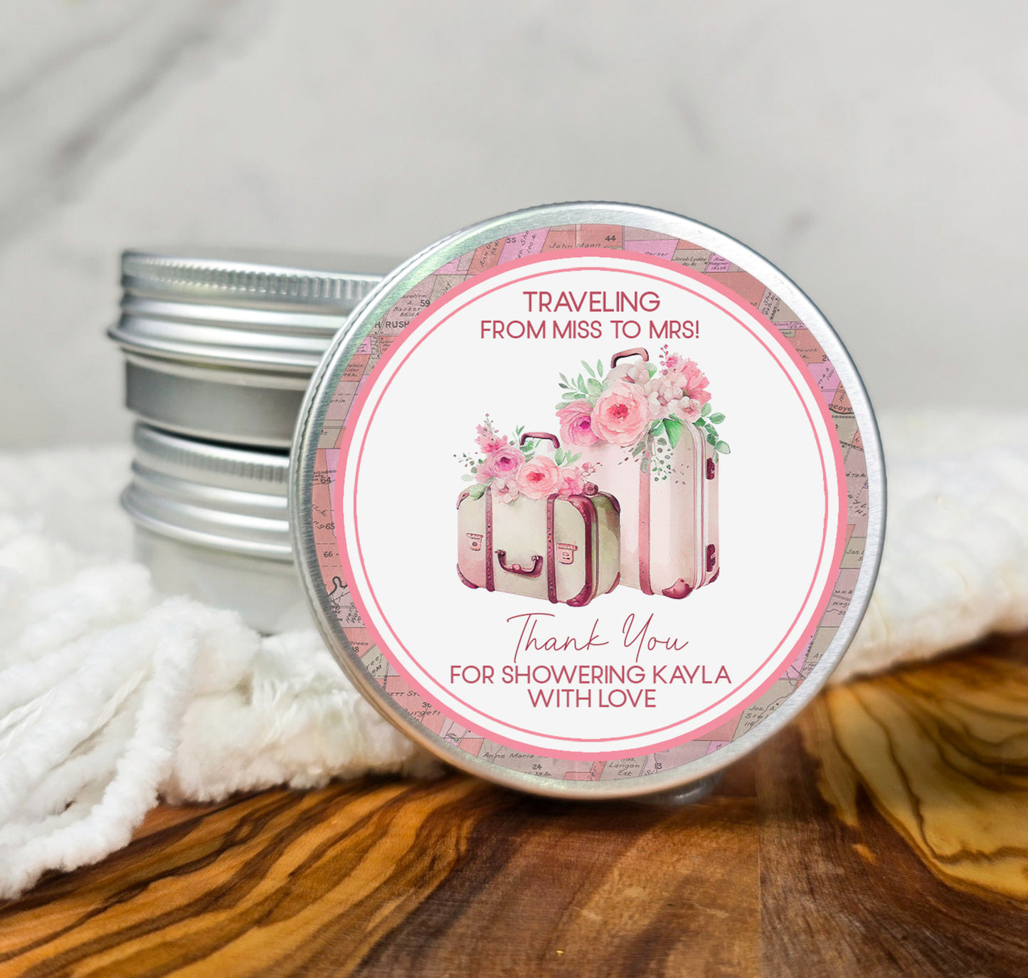 a small tin of personalized wedding favors