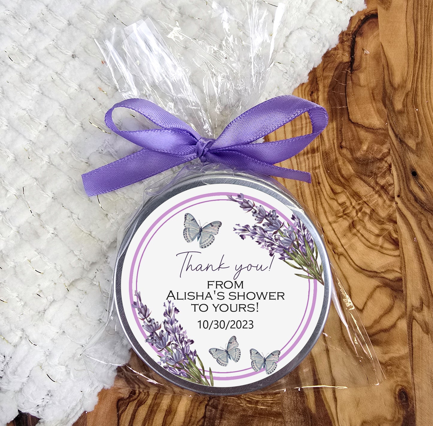 a jar of personalized soap with a purple ribbon