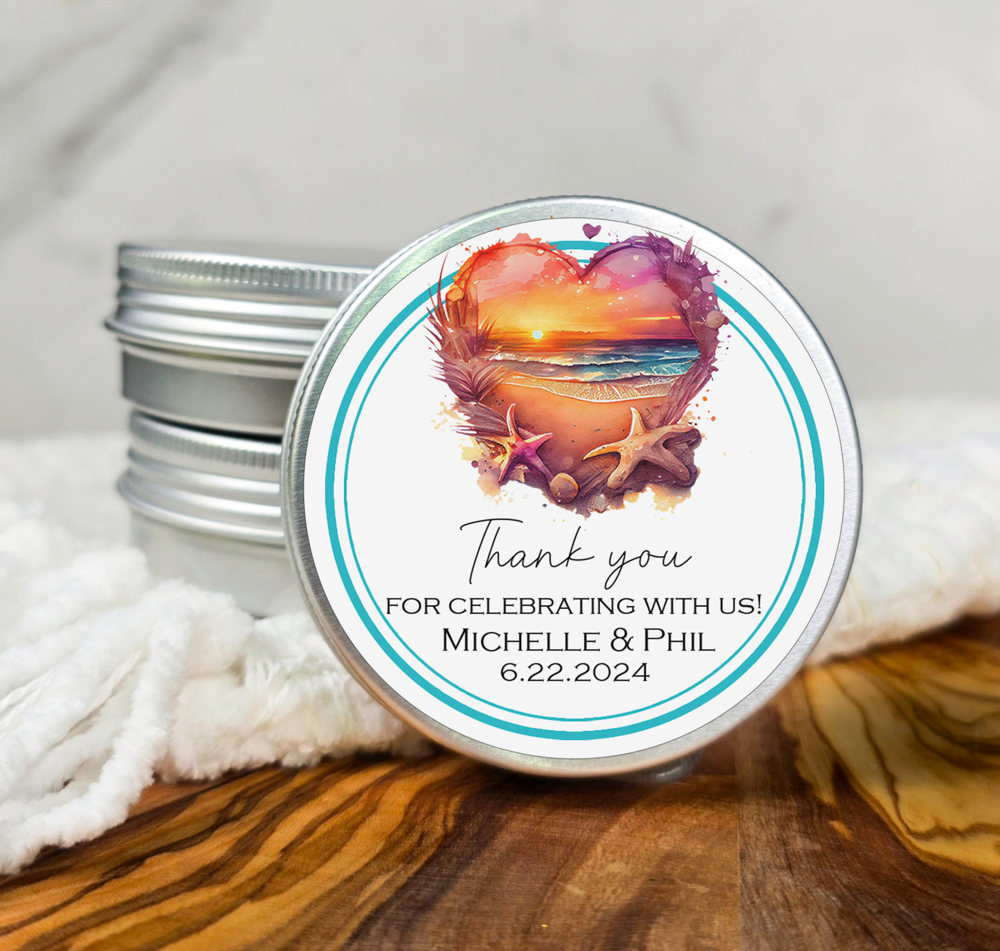 a couple of tins of personalized wedding favors