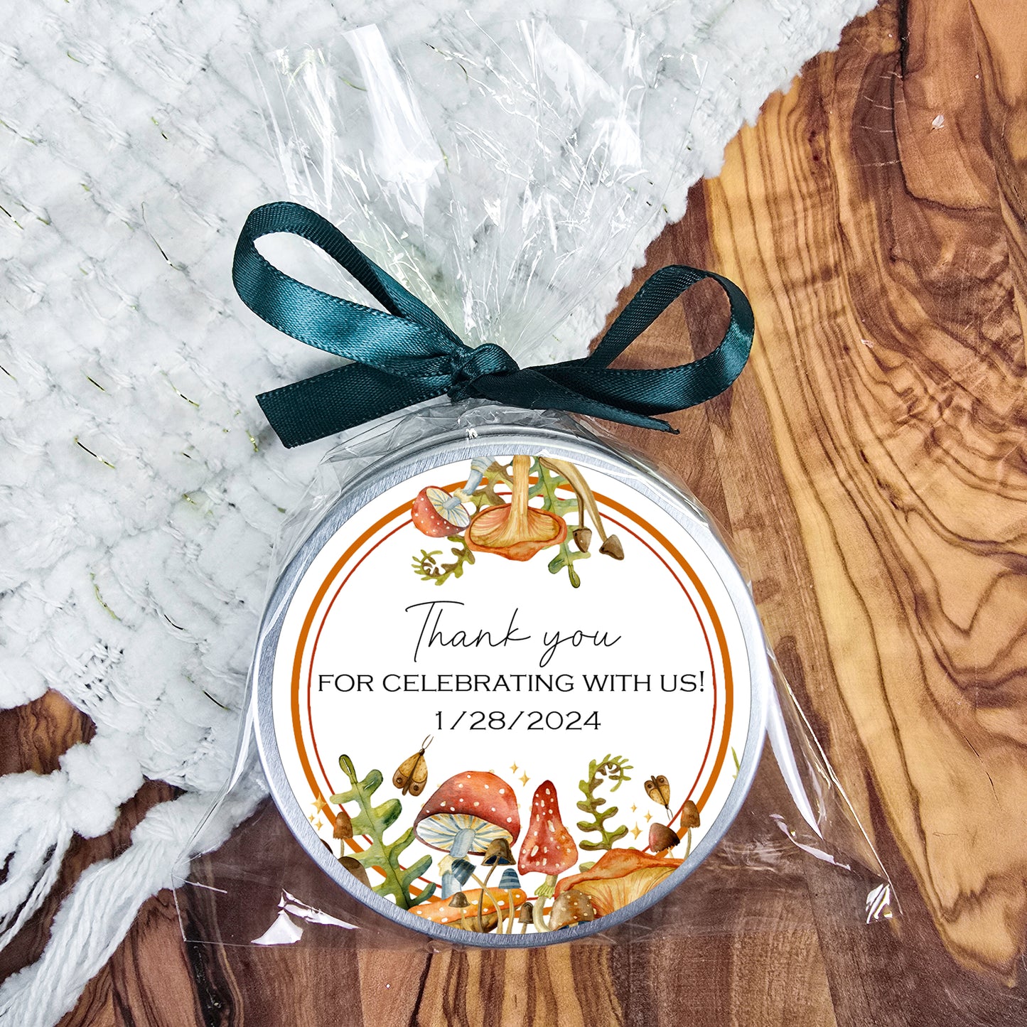 a round ornament with a ribbon on a table