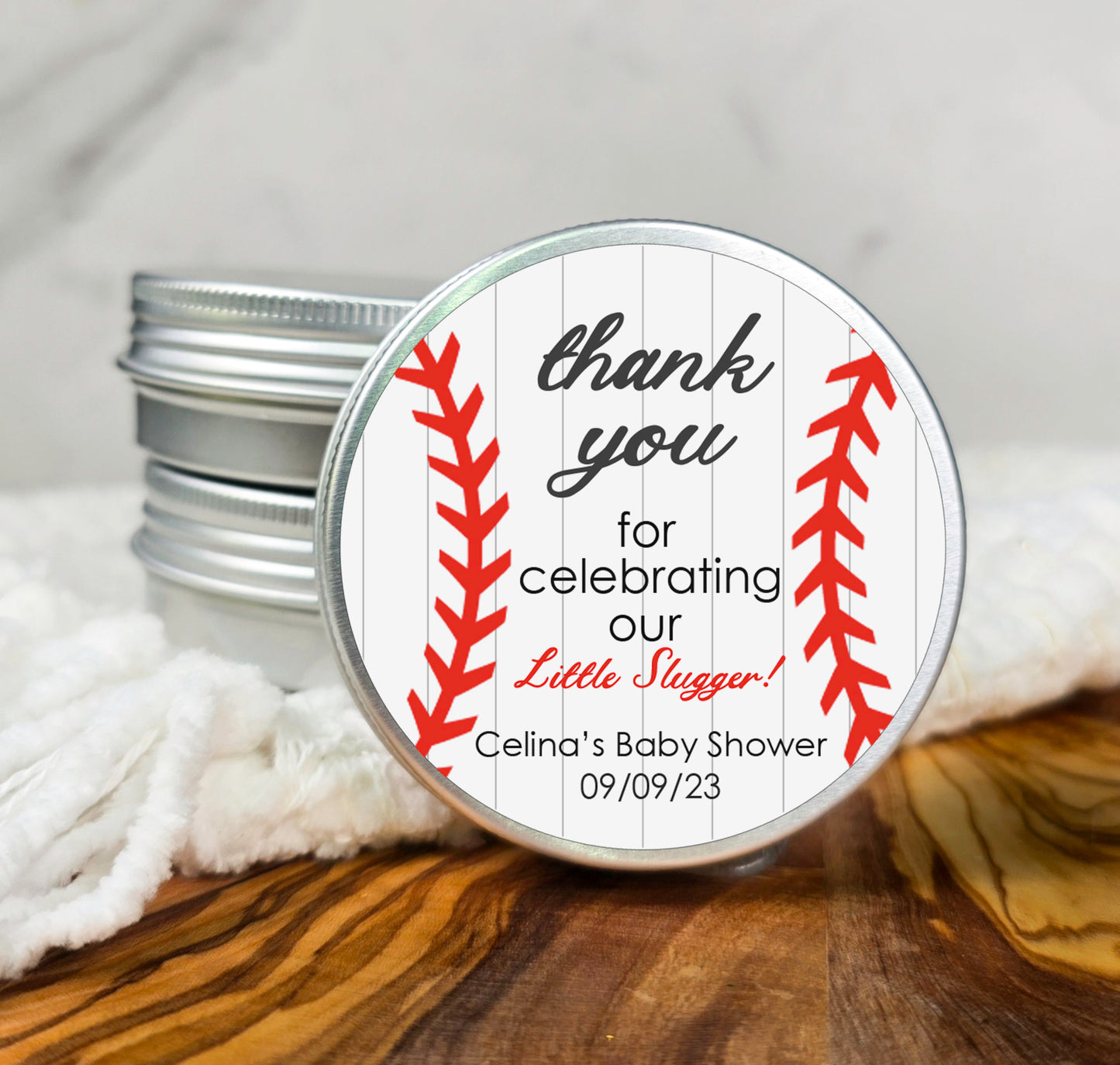 a baseball themed baby shower gift with a thank you for celebrating our little league team