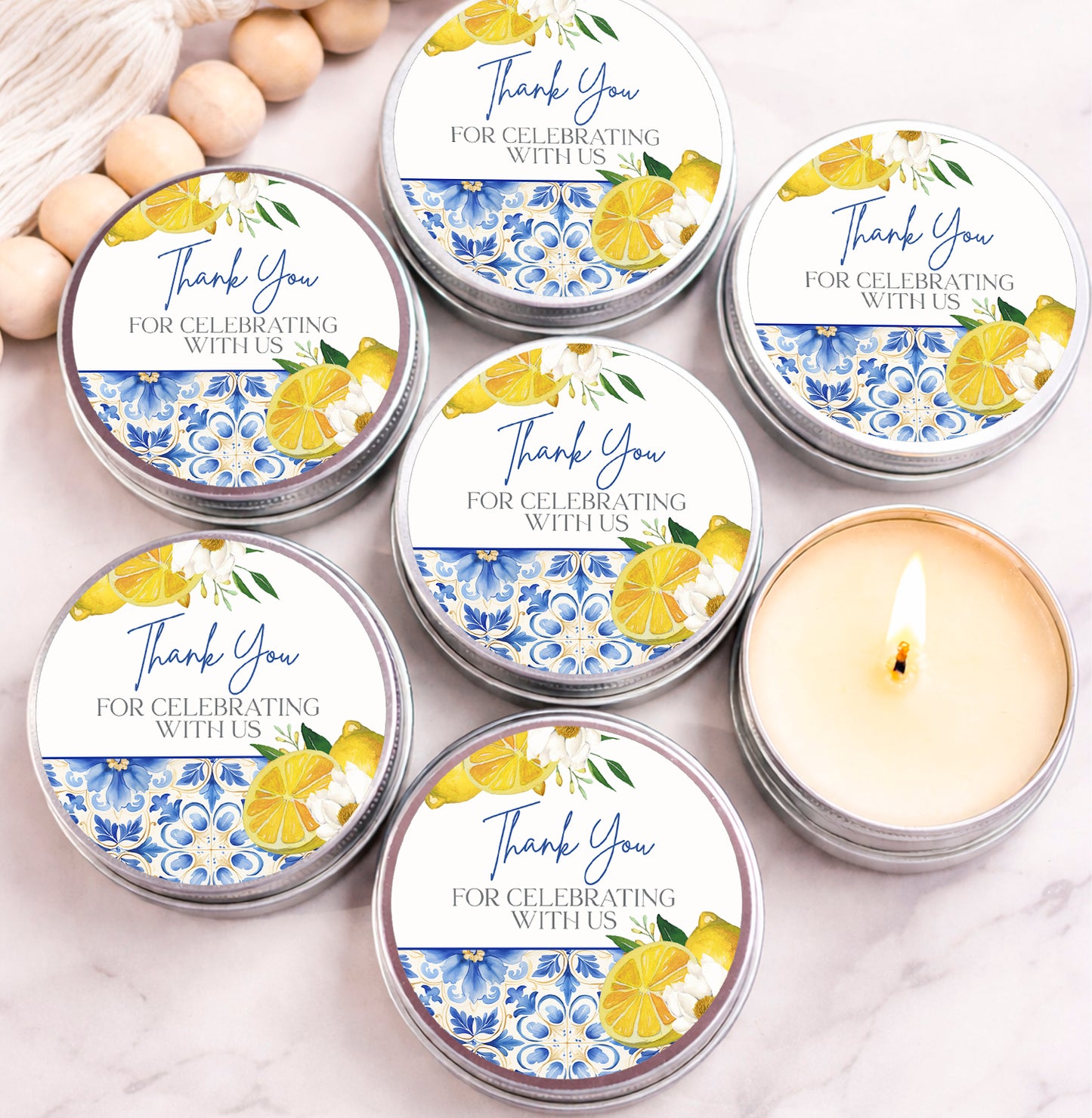 six silver tins with a floral design and text that says "Thank You for celebrating with us" on them.
