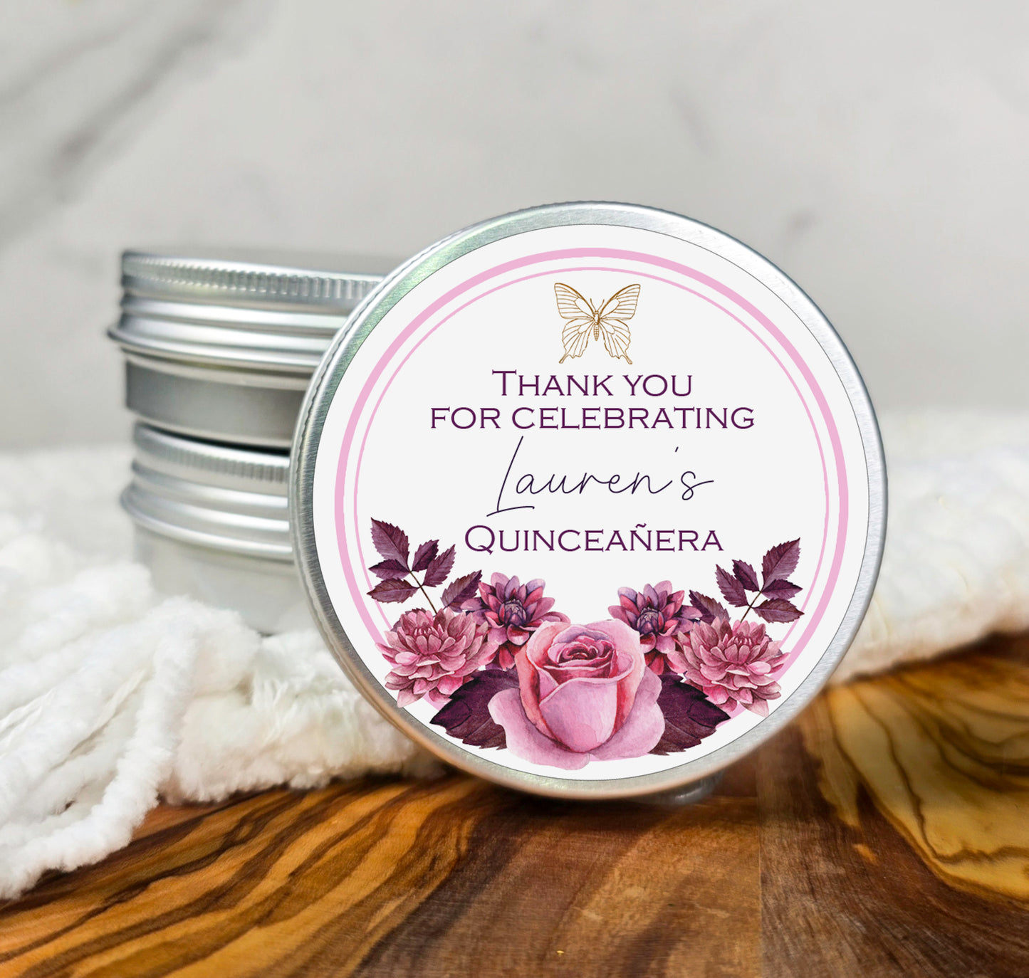 a jar of personalized candles on a table