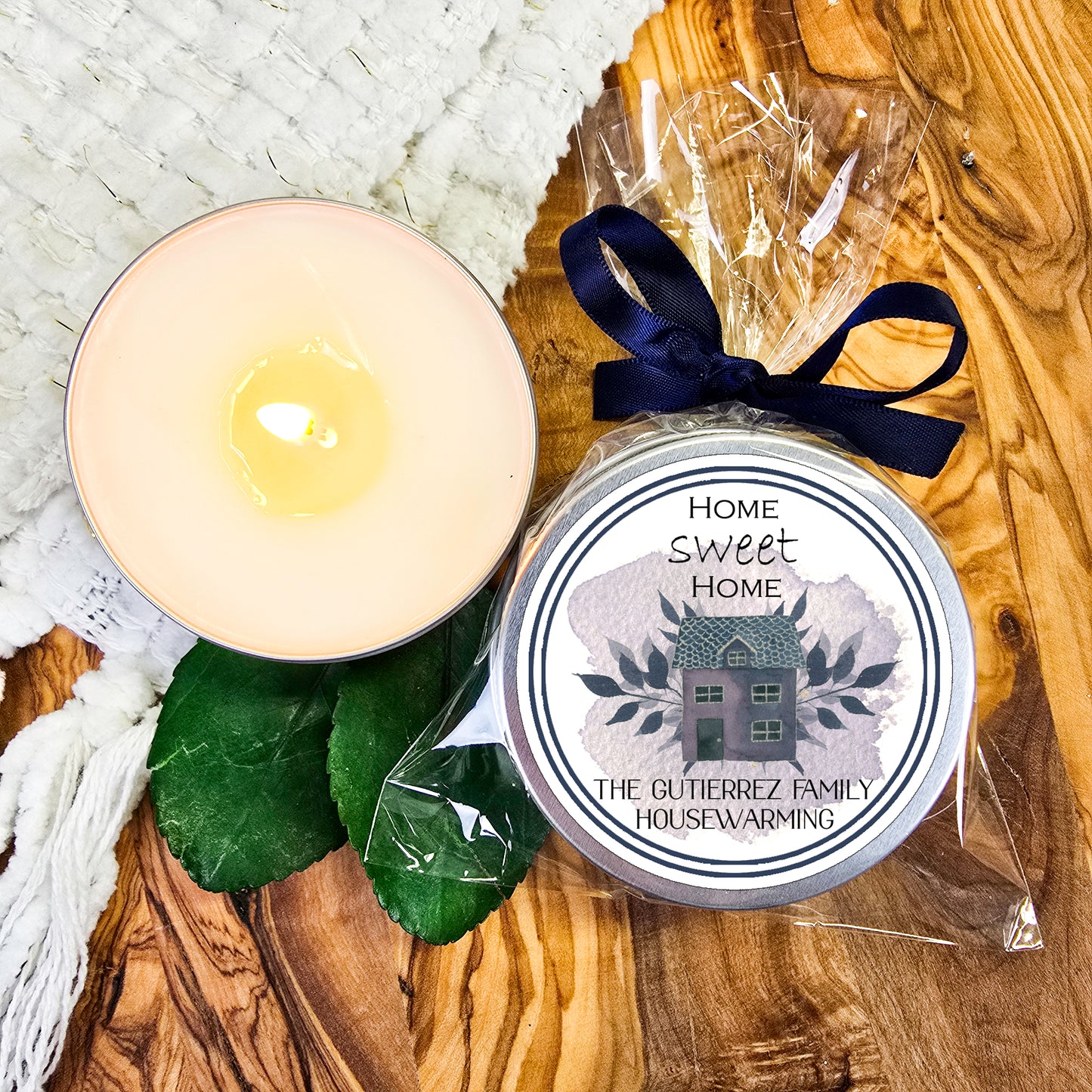 a candle next to a candle holder on a wooden table