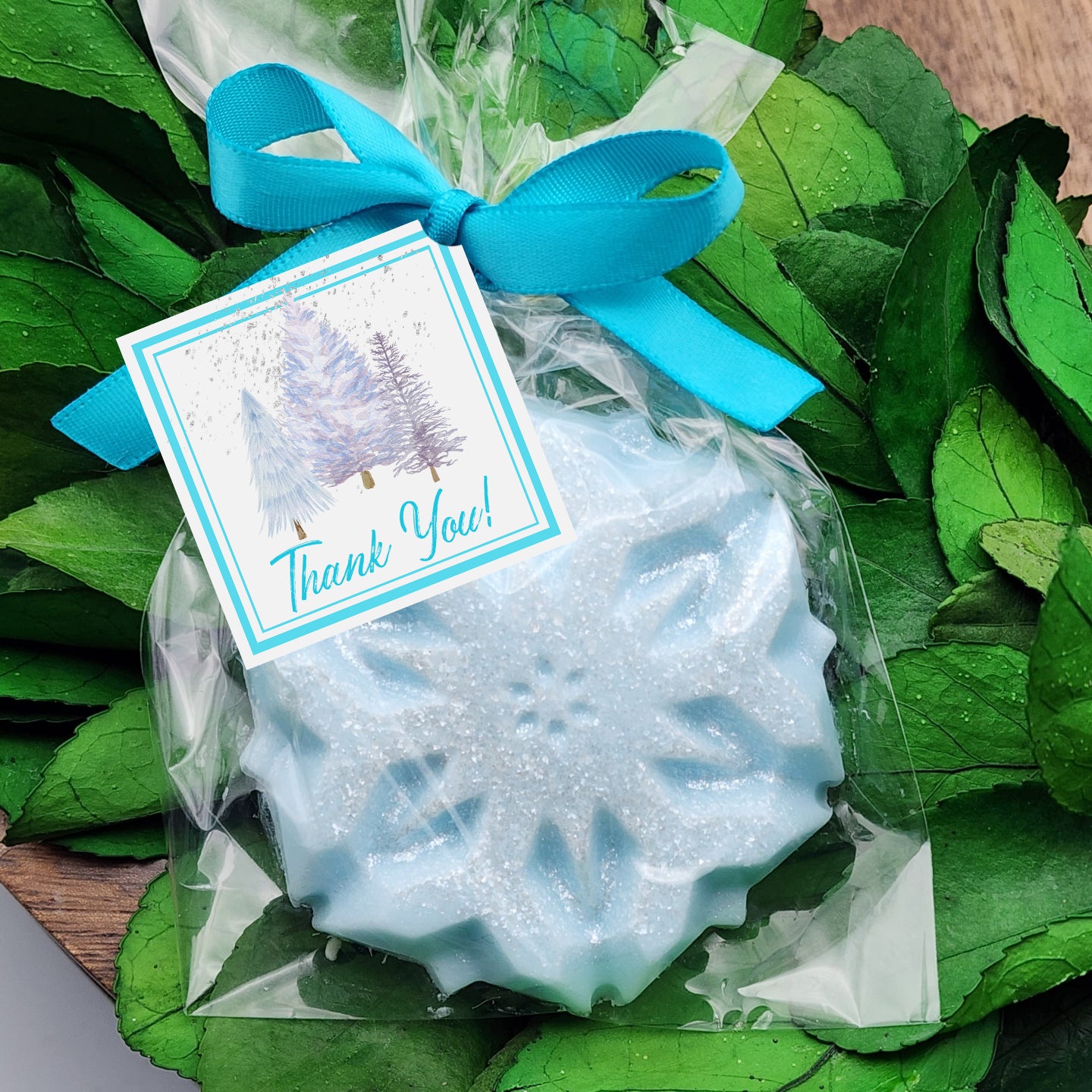 a thank you soap with a blue ribbon on it