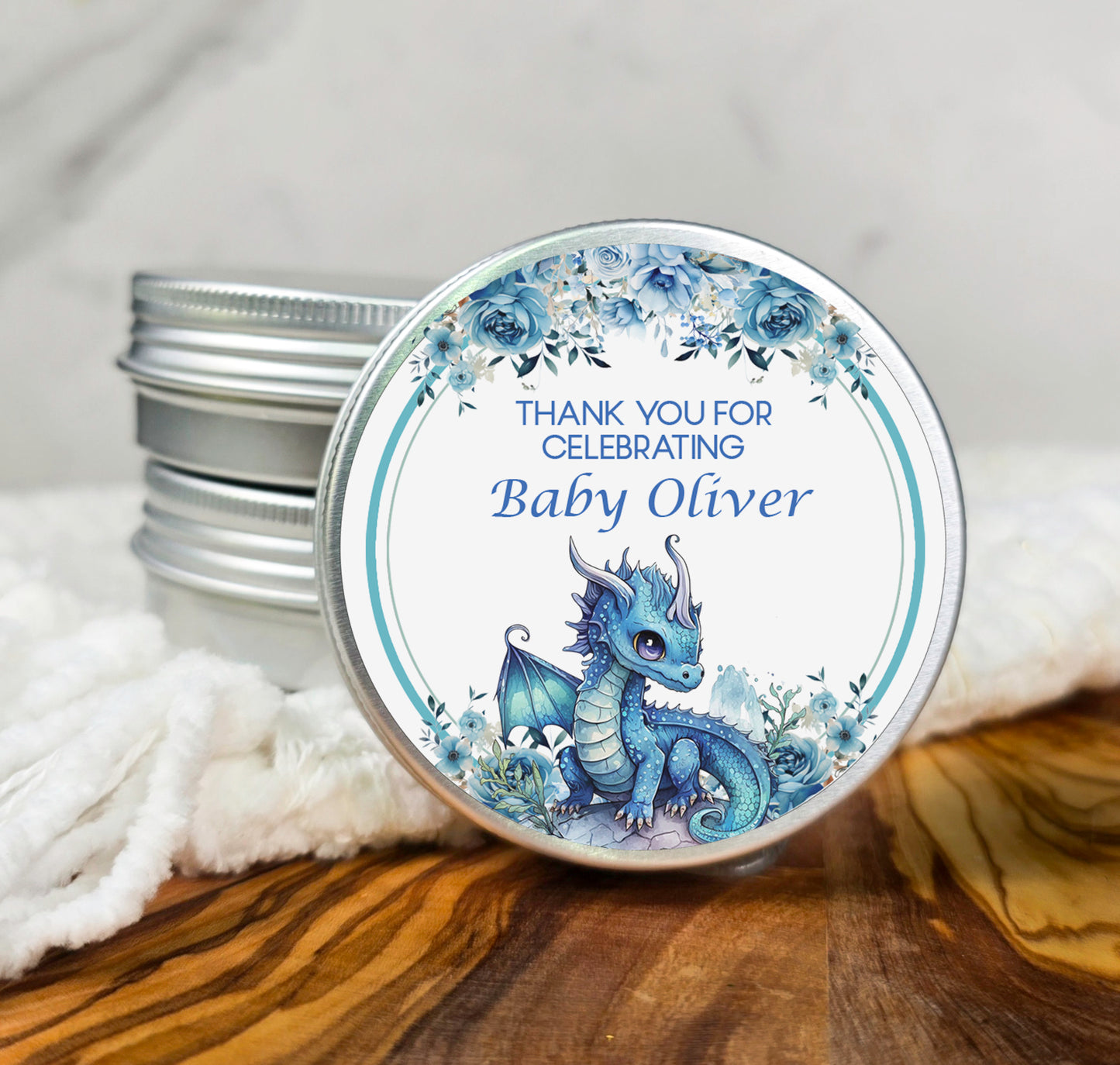 a small tin with a baby dragon on it