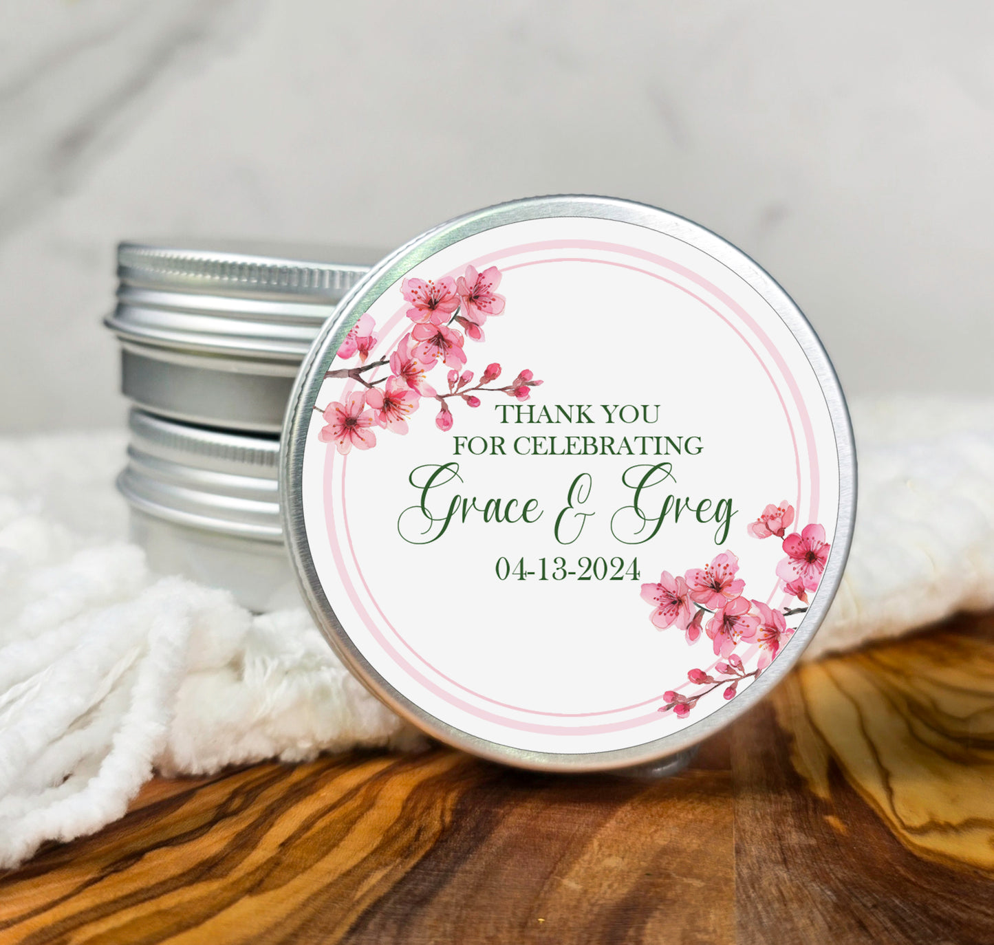 a jar of personalized wedding favors on a table