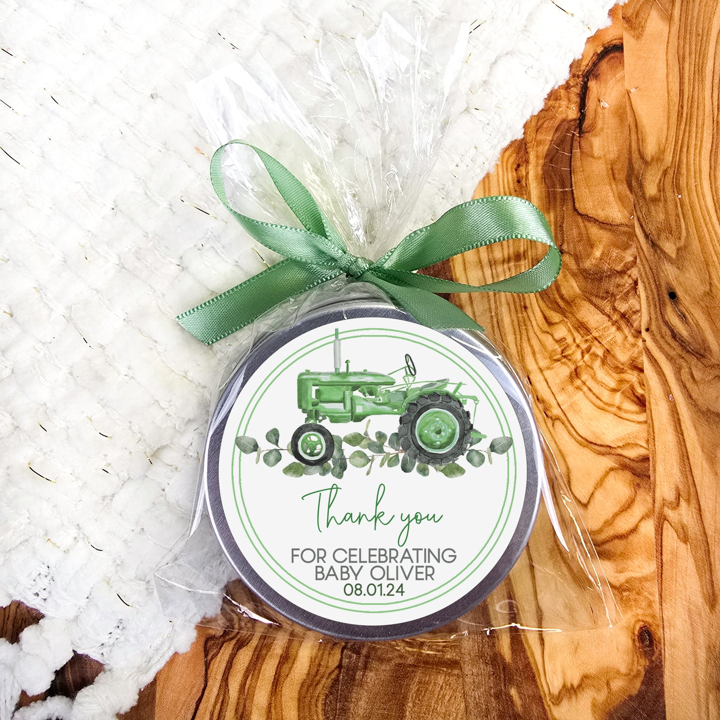 a green and white tag with a tractor on it