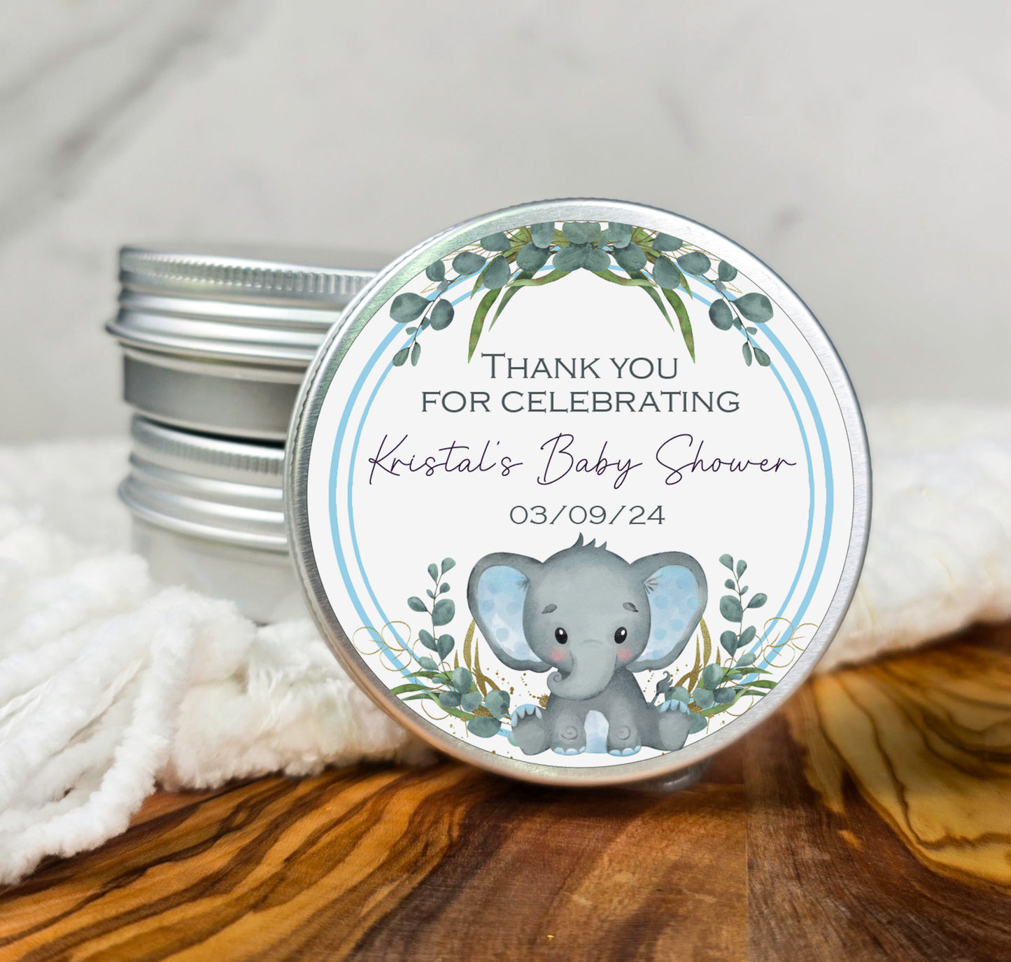 a small tin of baby shower soap with an elephant on it