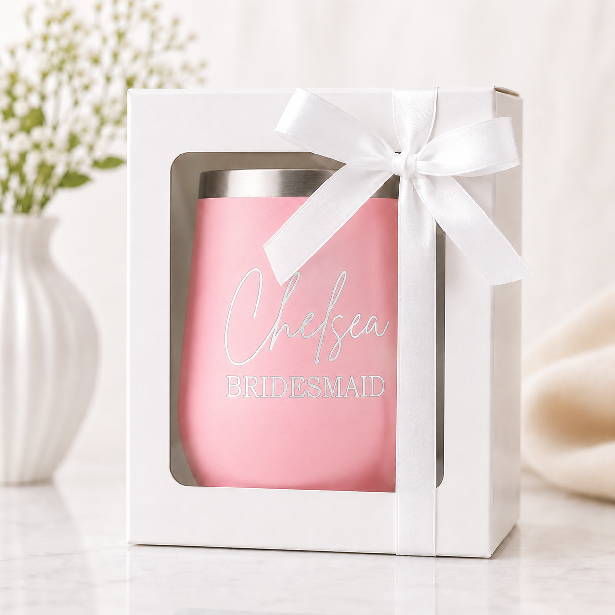 Personalized pink bridesmaid wine tumbler displayed in a white gift box with a satin ribbon bow. Features a custom engraved name and bridal party title, making a thoughtful bridesmaid proposal gift, maid of honor gift, or wedding party keepsake.