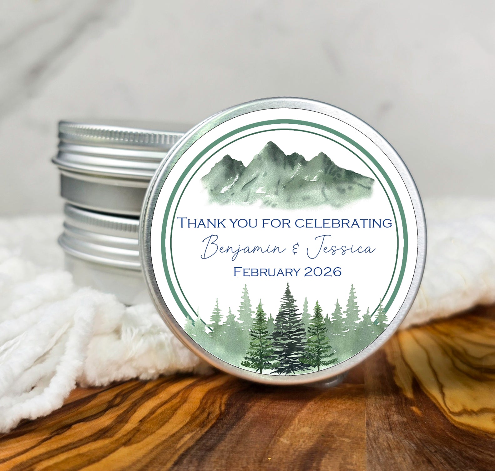 a couple of tins of personalized wedding favors