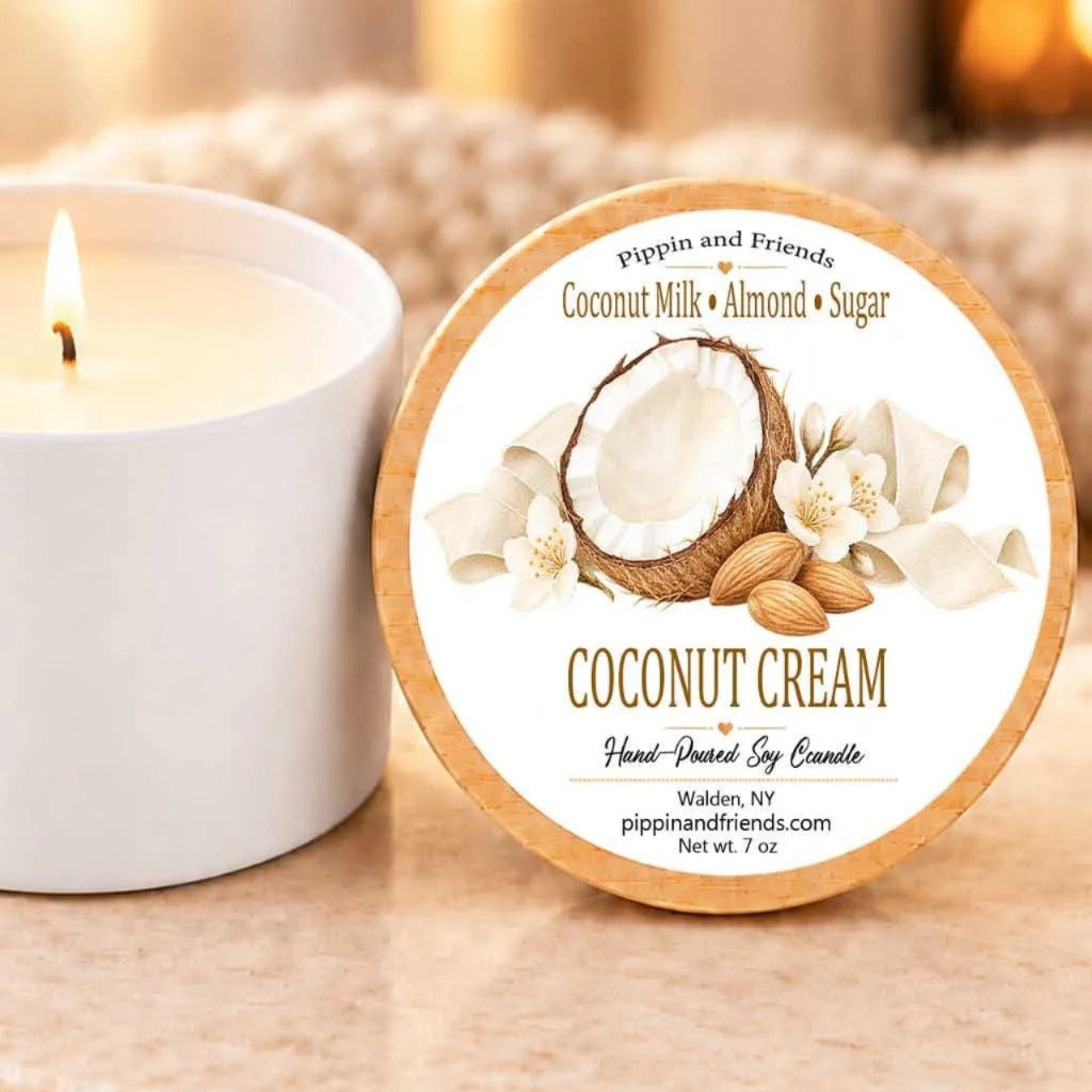 a white candle and a round label for a coconut cream candle.