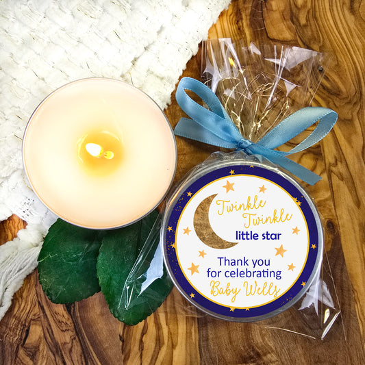 a candle and a card on a table