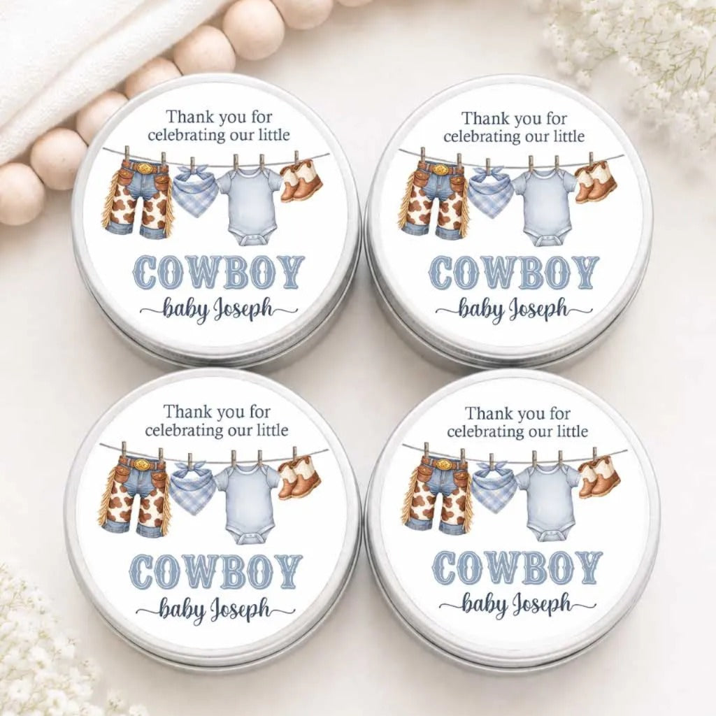 four round tin labels with illustrations of baby clothes and a cowboy theme, placed on a white background.