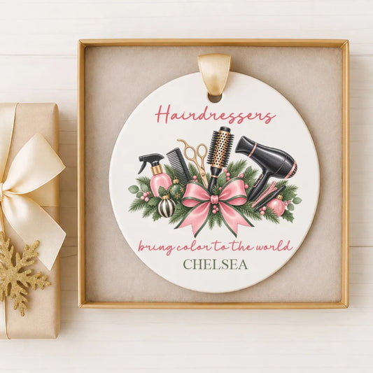 A decorative ornament featuring a stylized illustration of hair styling tools and accessories, along with the text "Hairdressers bring color to the world CHELSEA".