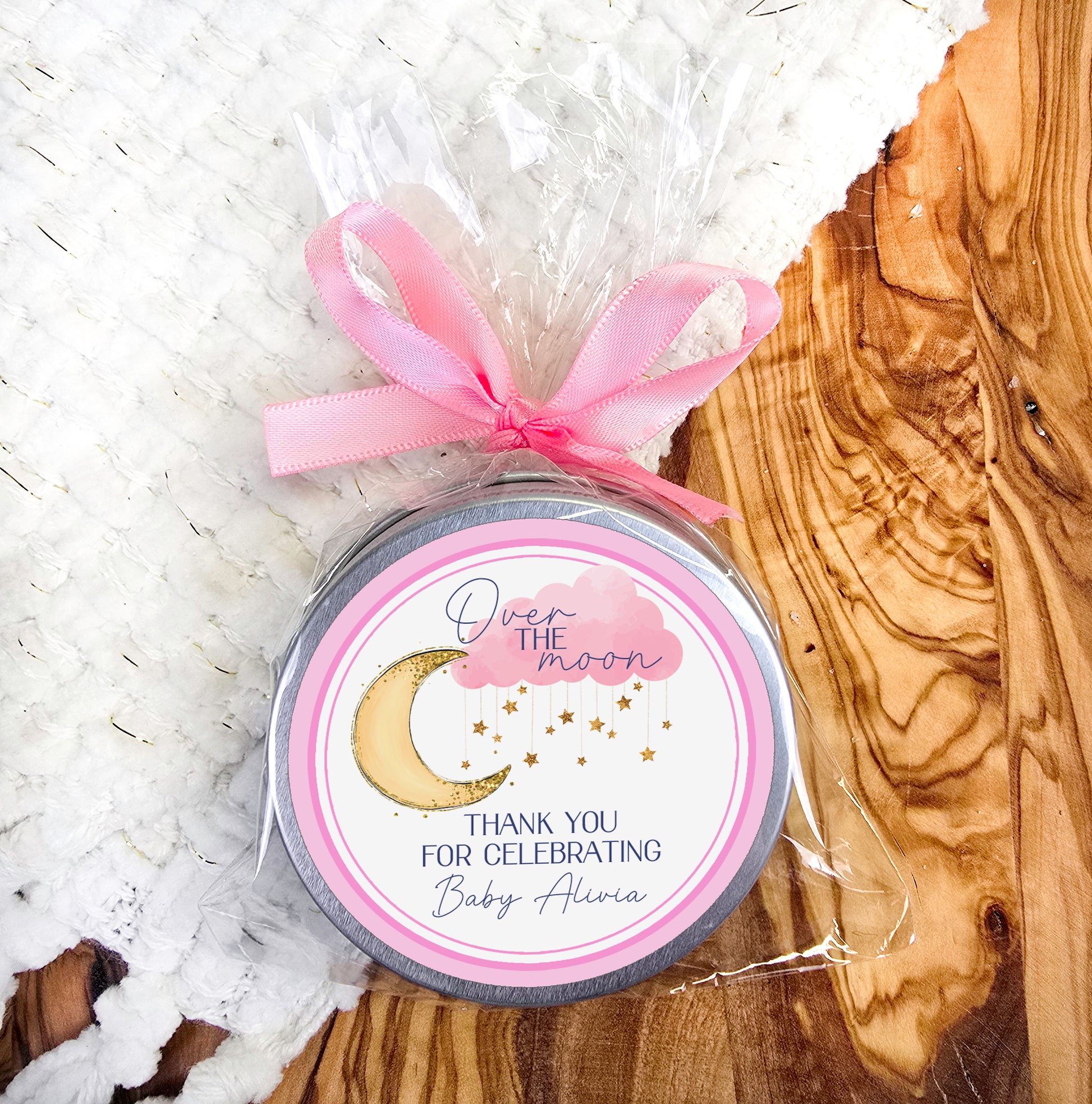 a jar of baby shower soap with a pink ribbon