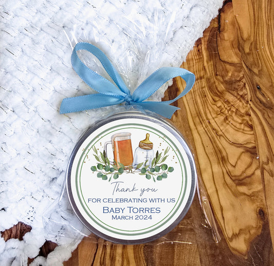 a tin of beer sitting on top of a wooden table