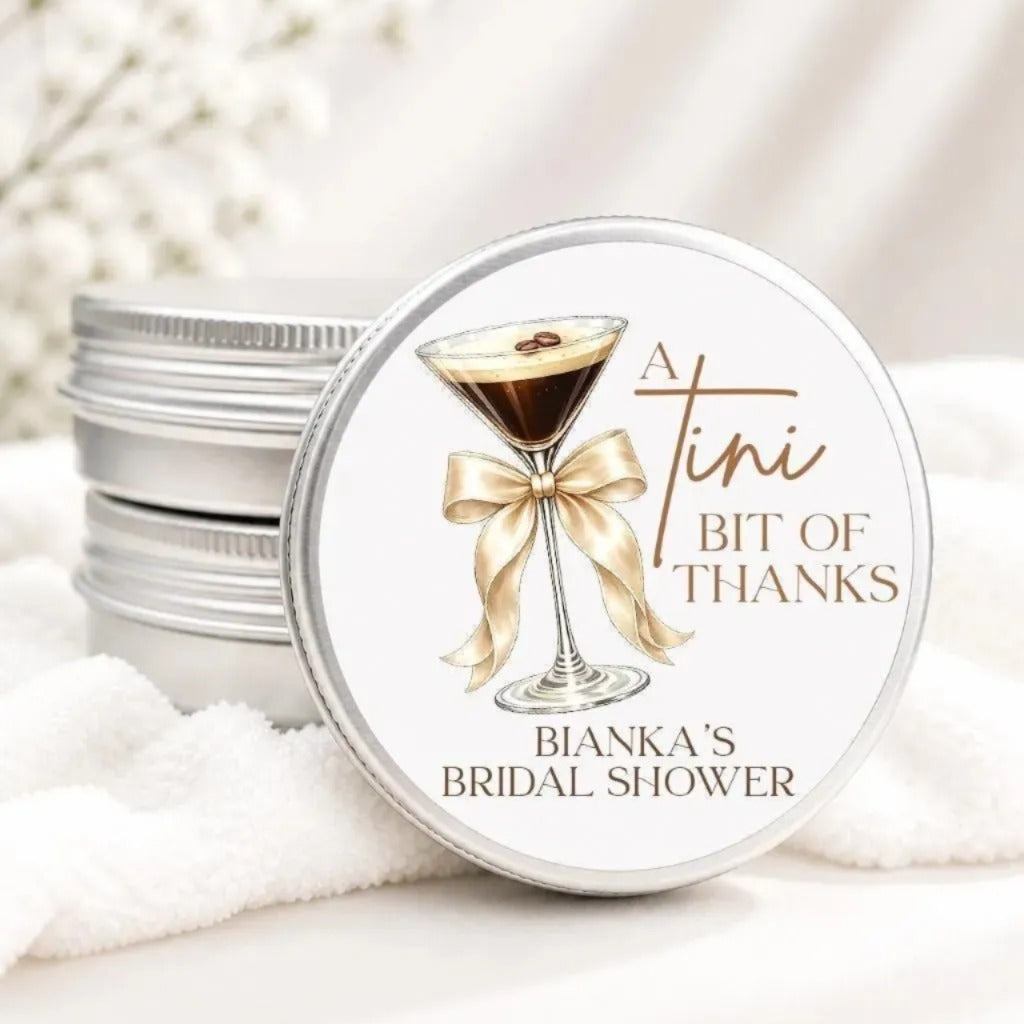 A round tin can with a label that says "A Tini Bit of Thanks" and "Bianca's Bridal Shower".