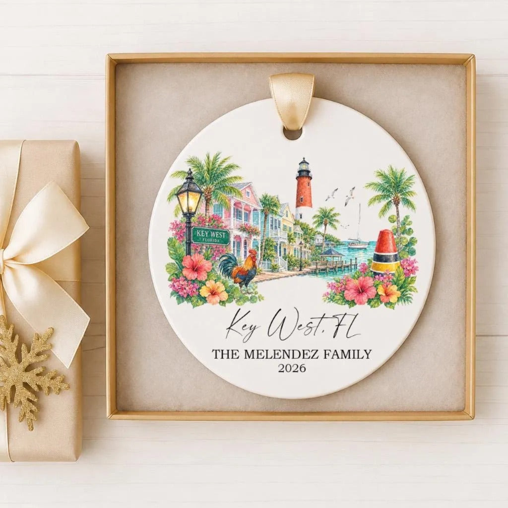 A decorative ornament featuring a tropical scene with palm trees, a lighthouse, and colorful flowers, along with the text "Key West, FL" and "THE MELENDZ FAMILY 2026".