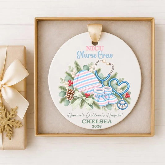 A decorative ornament with a white background, featuring illustrations of a stethoscope, baby booties, and a heart. The text on the ornament reads "NICU Nurse Crew" and "Hopewell Children's Hospital Chelsea 2026".