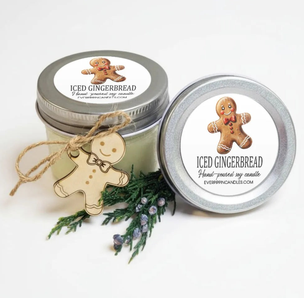 two jars of Iced Gingerbread candles, each with a label and a wooden gingerbread man decoration.