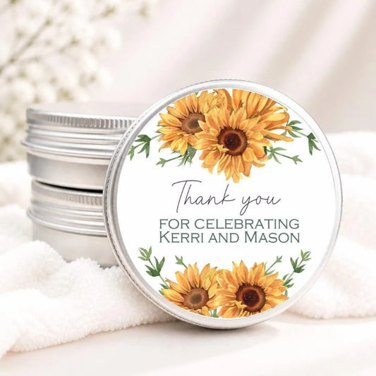 A round tin lid with a floral design and text on it, placed on a white cloth.