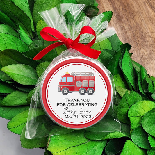 a personalized christmas ornament with a red firetruck on it