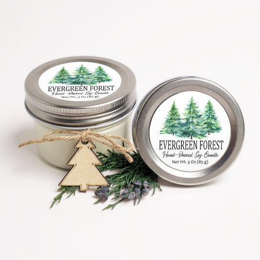 two jars of Evergreen Forest soy candles, one with a wooden tree charm and the other with a silver lid.