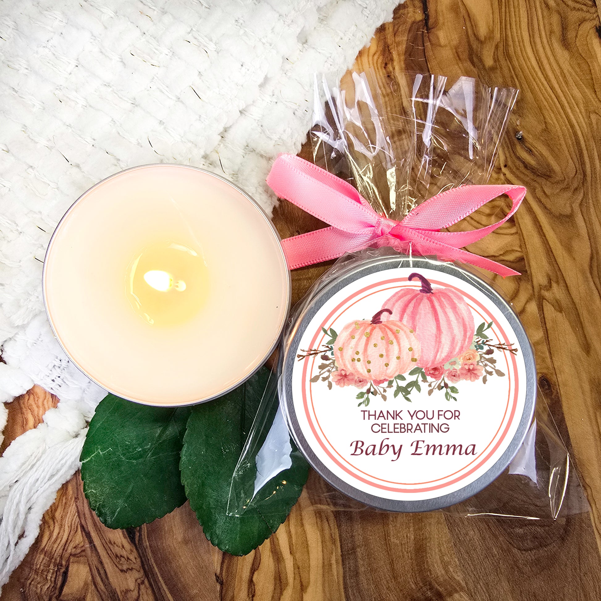 a candle and a jar of baby zinna