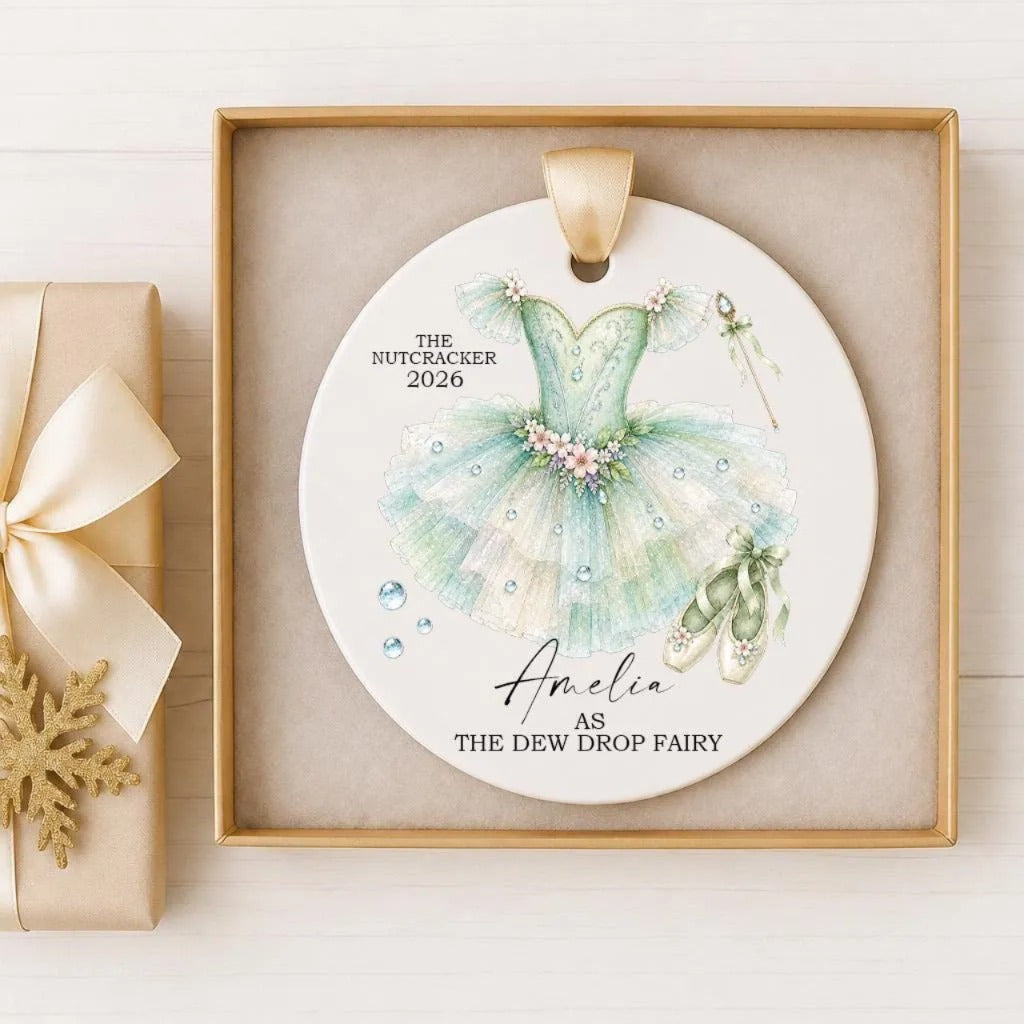 A decorative ornament featuring a ballerina's tutu and ballet slippers, with the text "The Nutcracker 2016" and "Amelia as The Dew Drop Fairy" displayed on it.