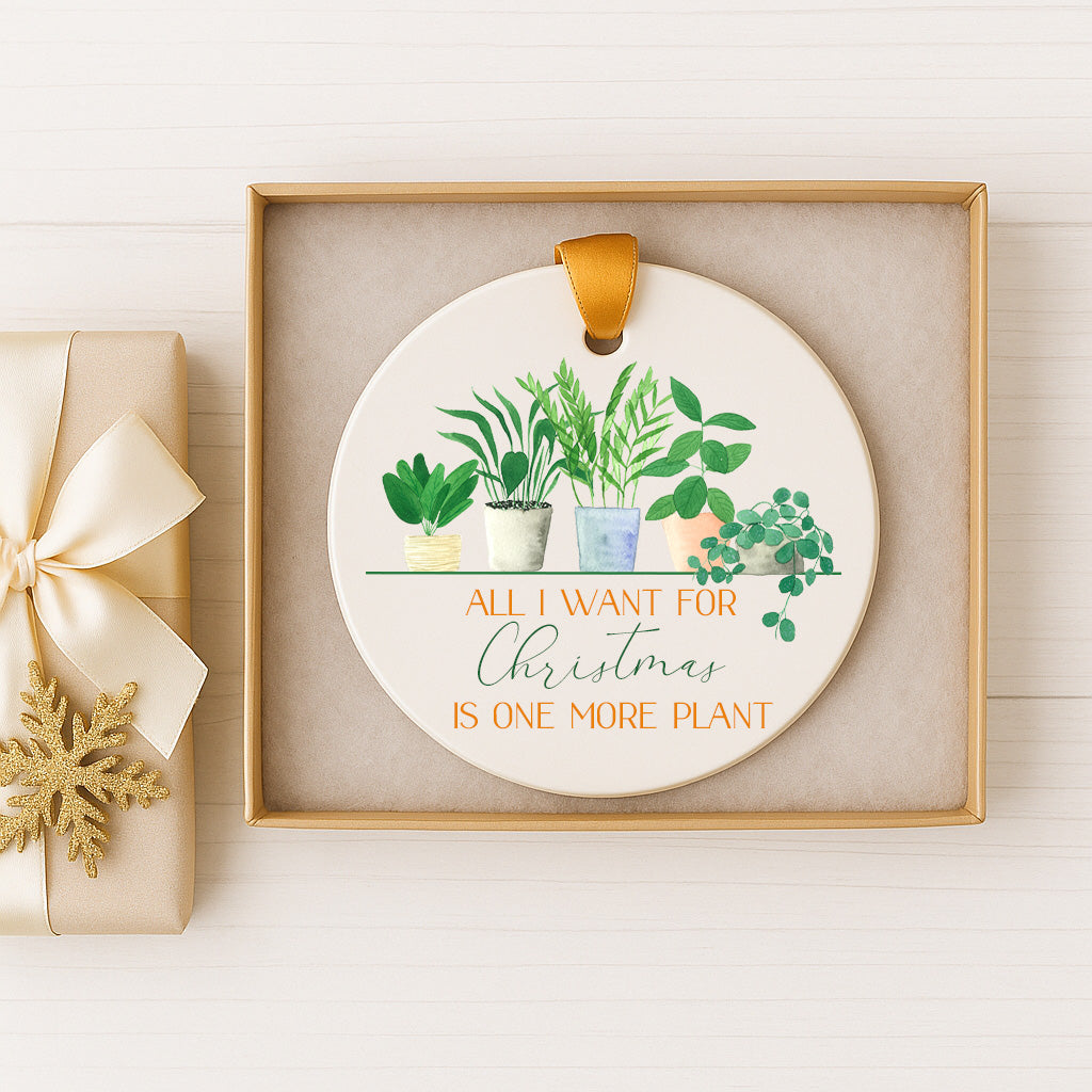 A decorative ornament with a potted plant and the text "All I want for Christmas is one more plant" is displayed in a box.