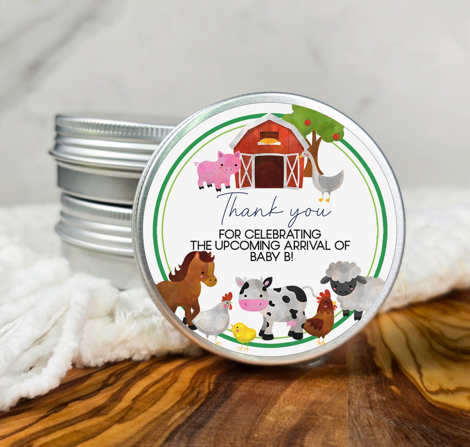 a tin of personalized birthday candles with farm animals on it