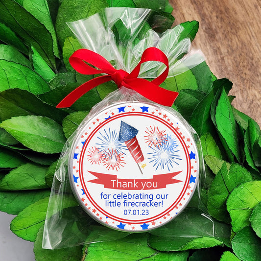 a red, white and blue ornament with a red ribbon