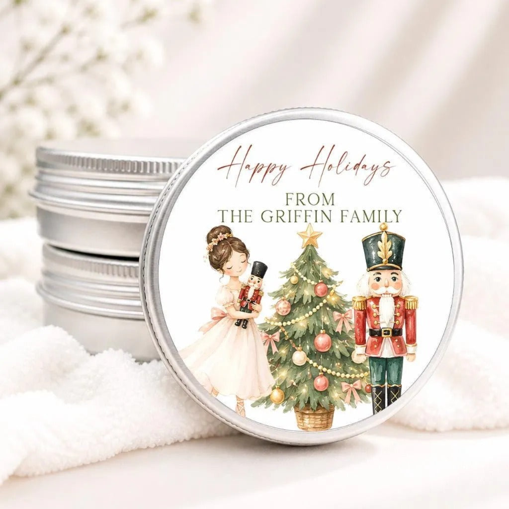 A round tin lid with a Christmas-themed illustration on it, featuring a nutcracker and a girl in a white dress.